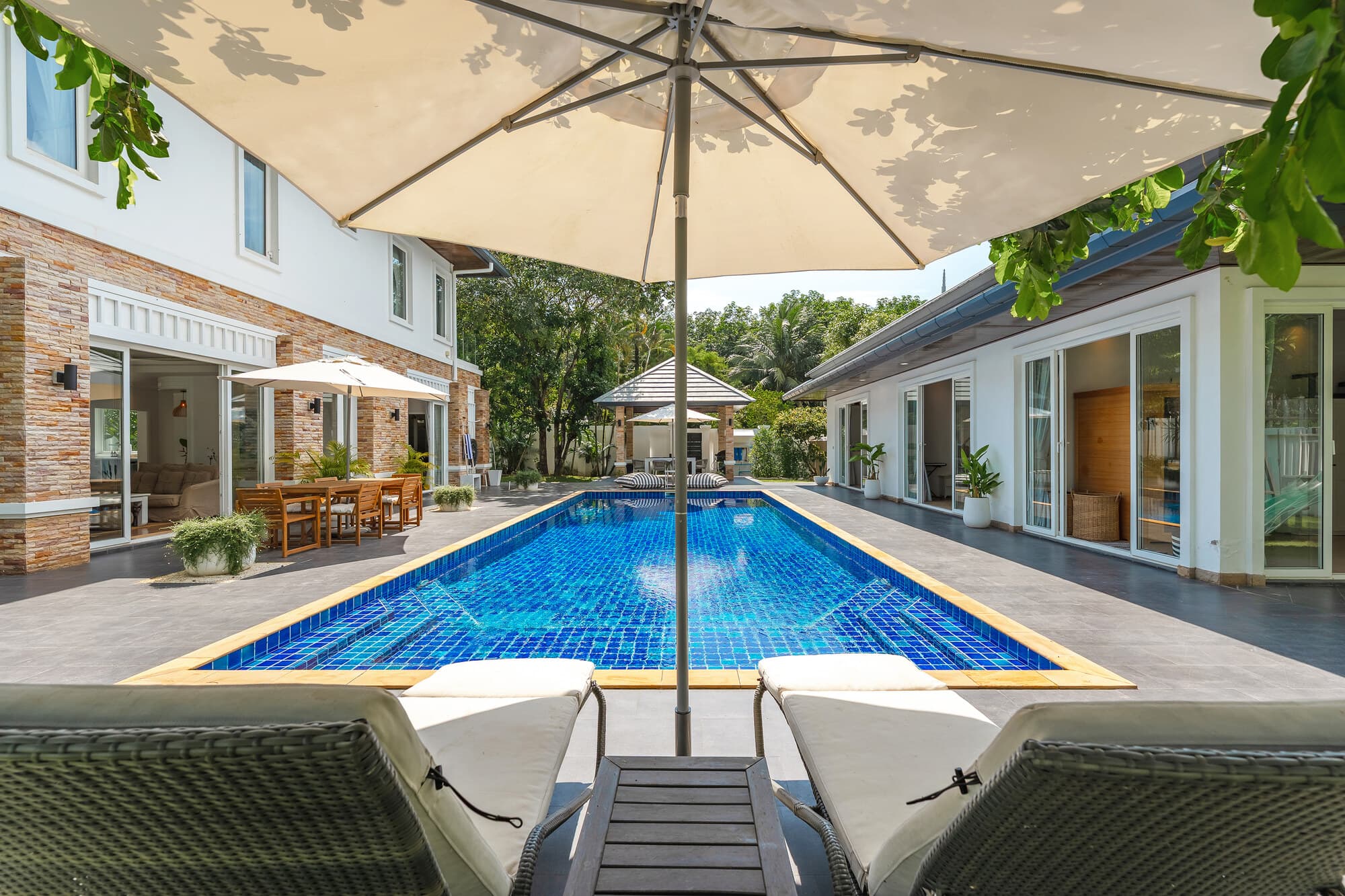 Villa Bussaba swimming pool framed by loungers and a parasol